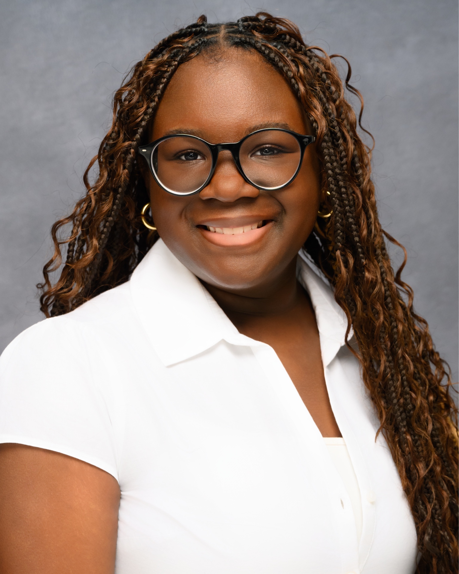 Temi Agboola Professional Headshot with Glasses